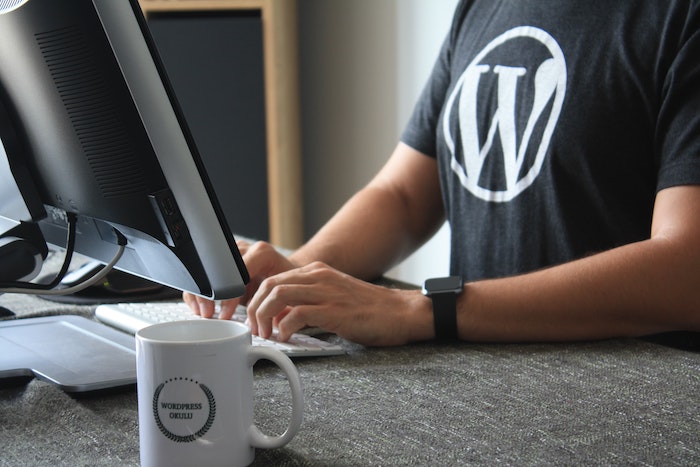 Man wearing black shirt with the WordPress logo.